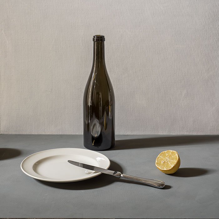 Assiette, couvert et citron